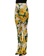 Dolce & Gabbana multicolor floral high waist straight pants displayed on a model with a vibrant floral pattern.