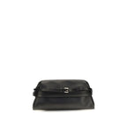 Moschino black goatskin clutch bag with sleek design and gold-tone hardware on a plain background.