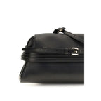 Moschino black goatskin clutch bag with sleek design and gold-tone hardware, perfect for evening or formal occasions.