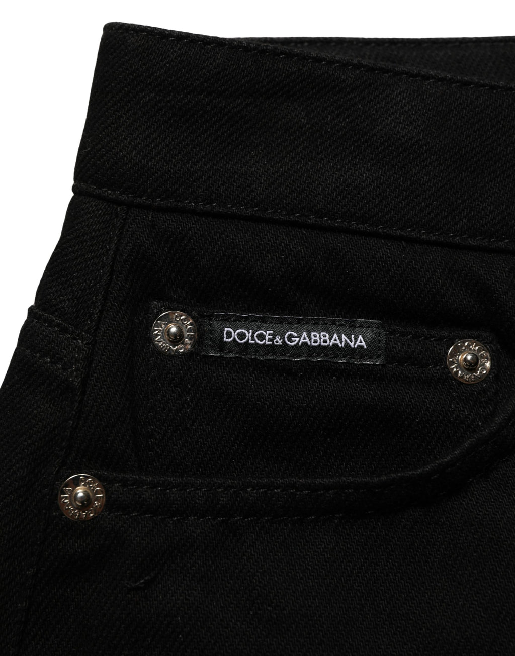 Dark gray cotton Dolce & Gabbana mid-rise denim hot pants shorts with distressed details and classic five-pocket design.