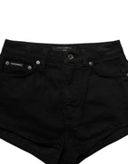 Dark gray cotton Dolce & Gabbana mid-rise denim hot pants shorts with frayed hem and classic five-pocket design.