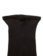 Dolce & Gabbana black wool tights showing the fitted stockings with a smooth, opaque texture and elastic waistband.