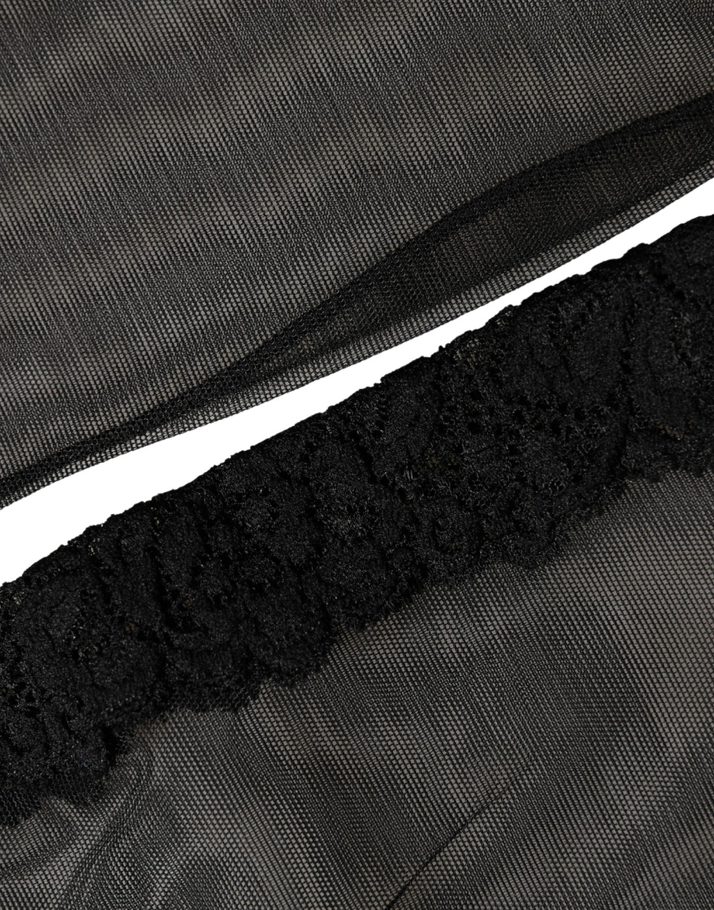 Black nylon mesh calf-length socks from Dolce & Gabbana with sheer, lightweight design and subtle branding detail.