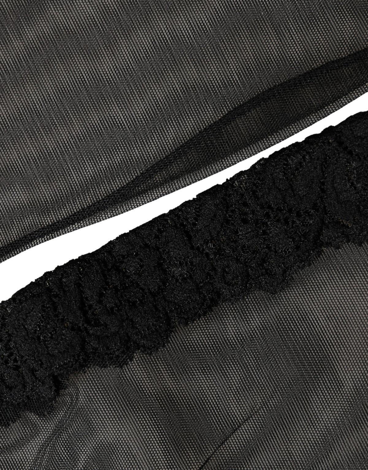 Black nylon mesh calf-length socks from Dolce & Gabbana with sheer, lightweight design and subtle branding detail.