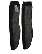 Black nylon mesh calf-length socks by Dolce & Gabbana featuring sheer design and subtle branding.