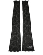 Dolce & Gabbana black floral lace nylon stretch knee-high socks displayed on a model's legs.
