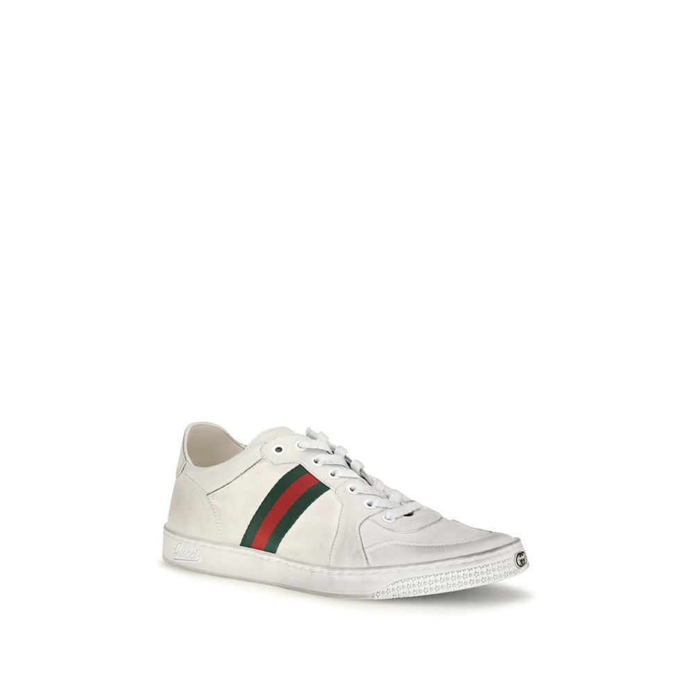 Gucci white calf leather Bos Taurus low top sneakers with sleek design and minimal branding, featuring white laces and rubber soles.