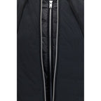 Black nylon Moose Knuckles bomber jacket with a sleek design and zipper details, displayed on a hanger.