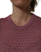 Pink Dolce & Gabbana sheer mesh sleeveless tank top with crew neck, showcasing a lightweight, stylish design.