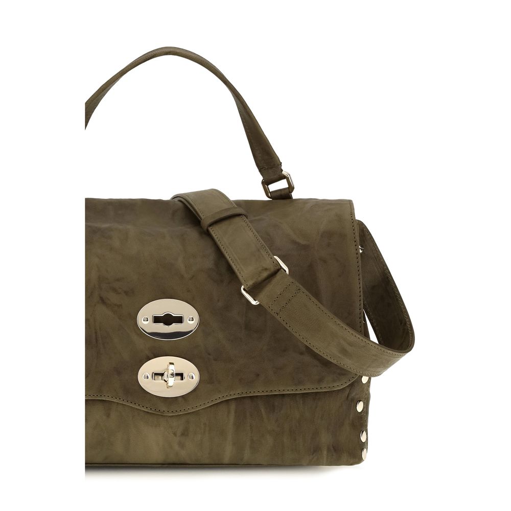 Zanellato brown suede leather handbag with structured shape and top handles, showcasing elegant craftsmanship and soft texture.