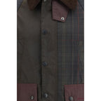 Barbour multicolor cotton shell jacket displayed on a hanger, featuring a lightweight design and vibrant color pattern.