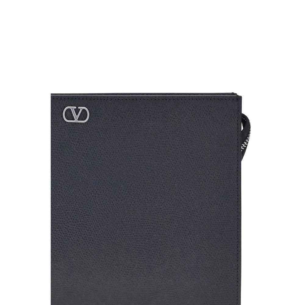 Valentino Garavani black calf leather Bos Taurus wallet with sleek design and subtle branding, perfect for stylish organization.