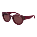 Polaroid purple plastic sunglasses with round frames and UV protection, stylish eyewear for sunny days.