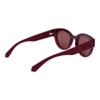 Polaroid purple plastic sunglasses with tinted lenses and stylish frame, suitable for casual outdoor wear.