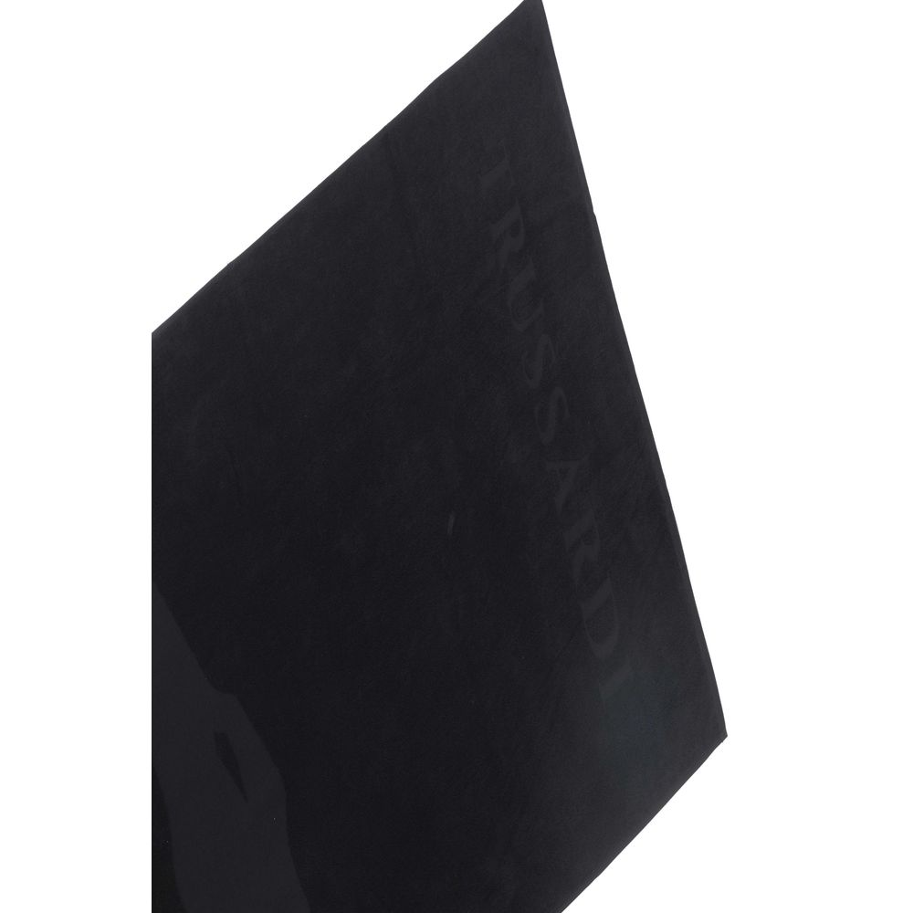 Black cotton Trussardi Beachwear men's beach towel with the Trussardi logo, featuring a soft, absorbent fabric for beach or pool use.