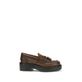 Brown calf leather Miu Miu Bos Taurus platform loafers with chunky soles and classic slip-on design.