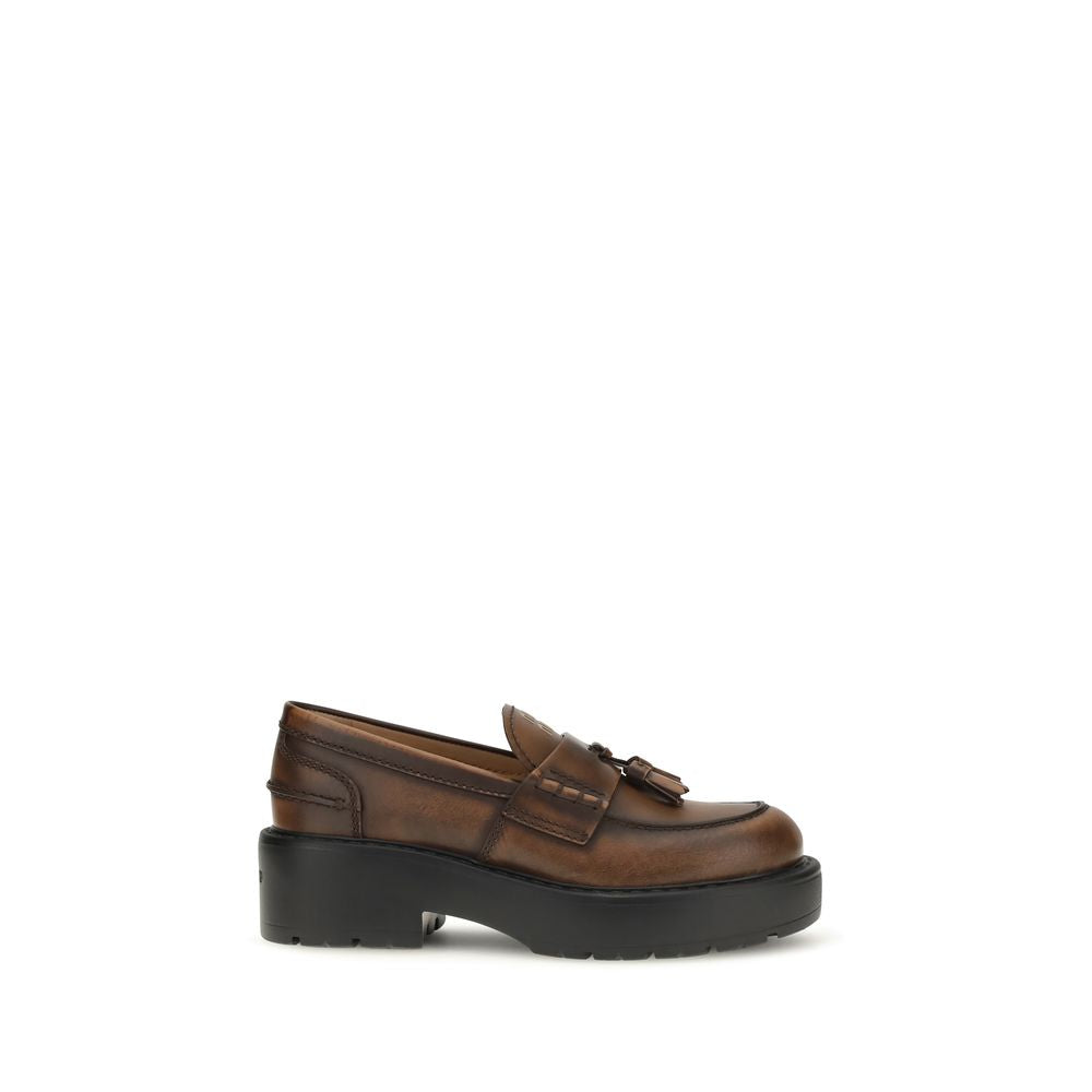 Brown calf leather Miu Miu Bos Taurus platform loafers with chunky soles and classic slip-on design.