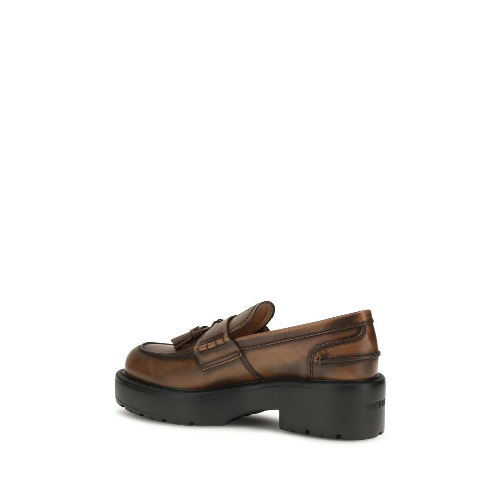 Miu Miu brown calf leather Bos Taurus platform loafers with slip-on design and chunky soles.