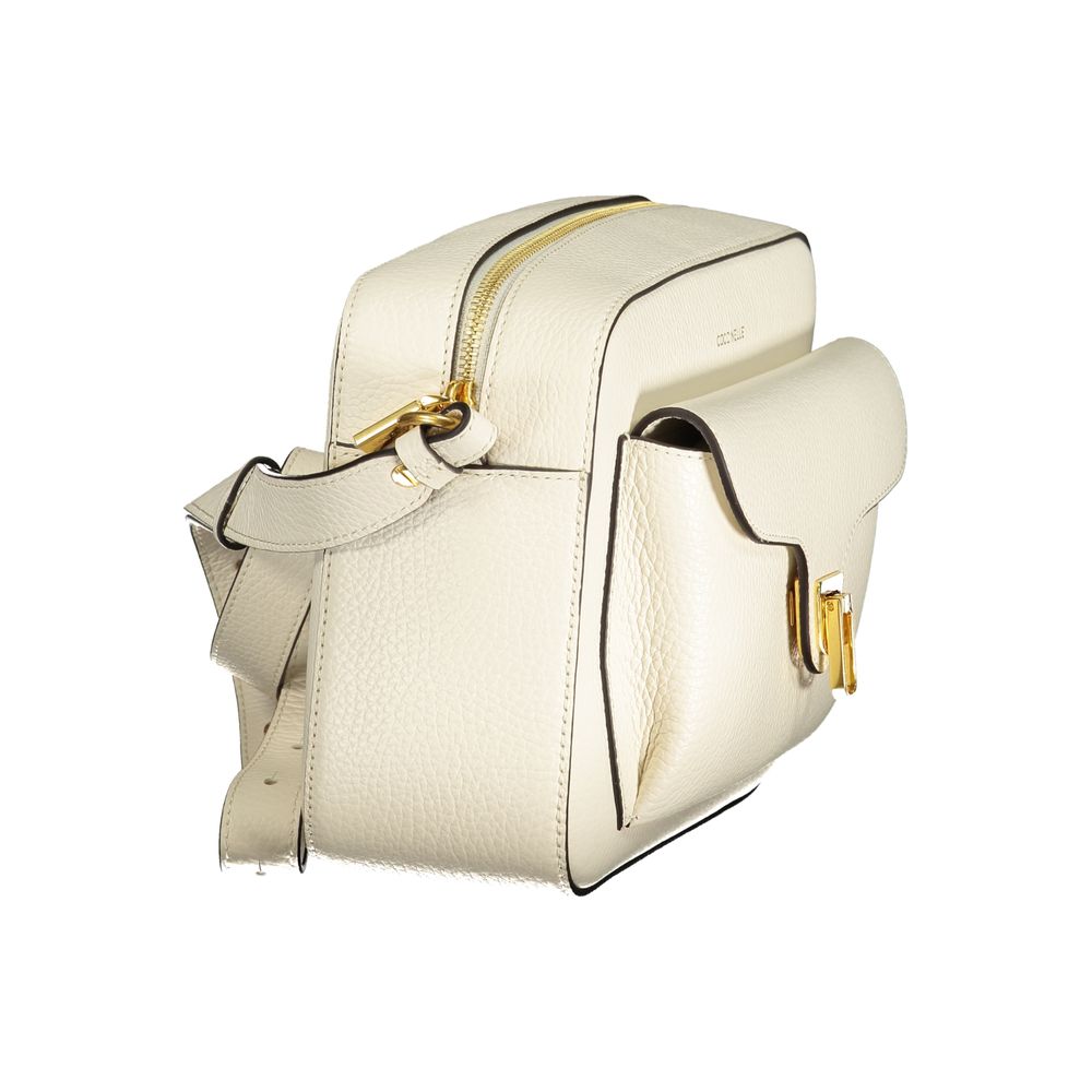 Coccinelle Bianco leather women's bag with sleek design and silver hardware, featuring adjustable shoulder strap and top zipper closure.