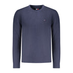 Tommy Hilfiger blue cotton men's sweater with crewneck and long sleeves, casual style, displayed on a hanger.