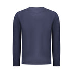 Tommy Hilfiger blue cotton men's sweater with ribbed cuffs and crew neckline, styled casually on a model.