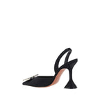 Amina Muaddi black satin high heel pumps with pointed toes and sleek design, perfect for elegant evening wear.