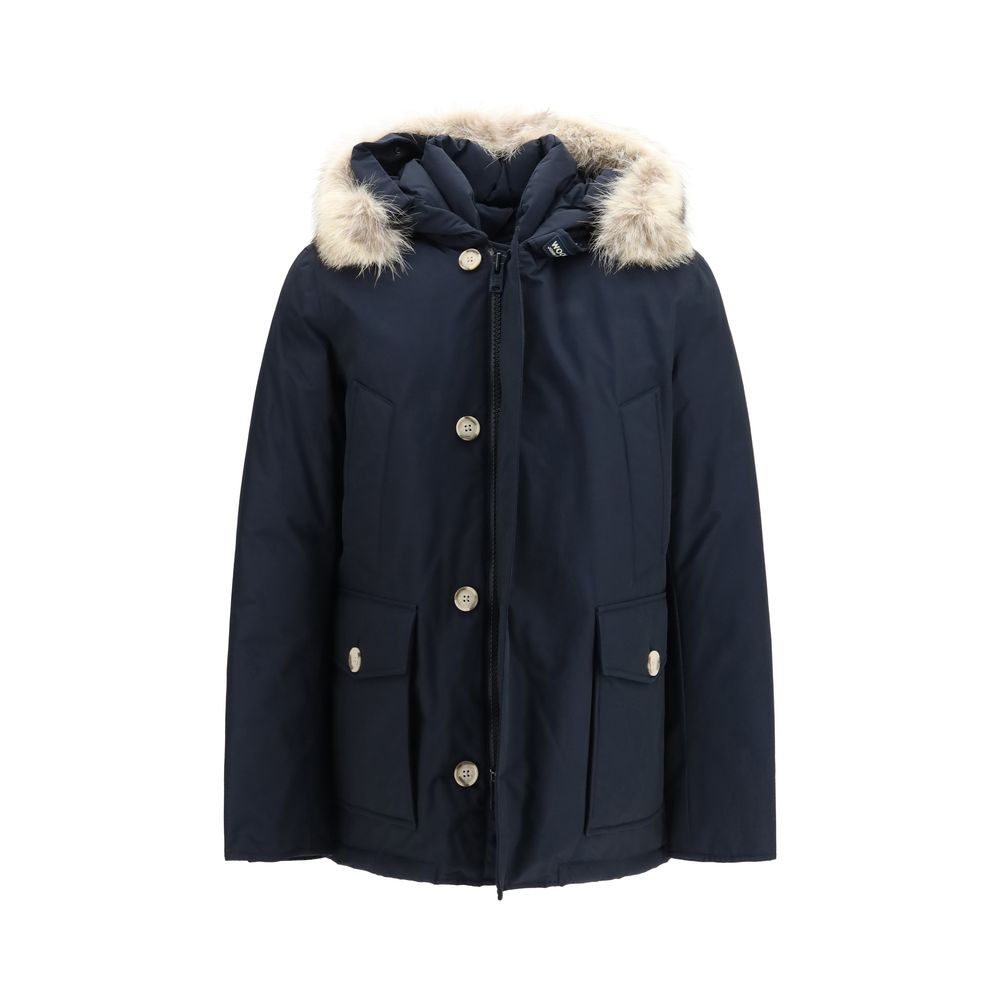 Woolrich blue cotton parka with hood, front zipper, and side pockets, suitable for casual outdoor wear.