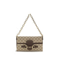 Gucci beige fabric shoulder bag with adjustable strap and subtle logo detailing, stylish accessory for everyday wear.