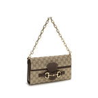 Gucci beige fabric shoulder bag with adjustable strap and subtle logo detail, stylish and versatile accessory.