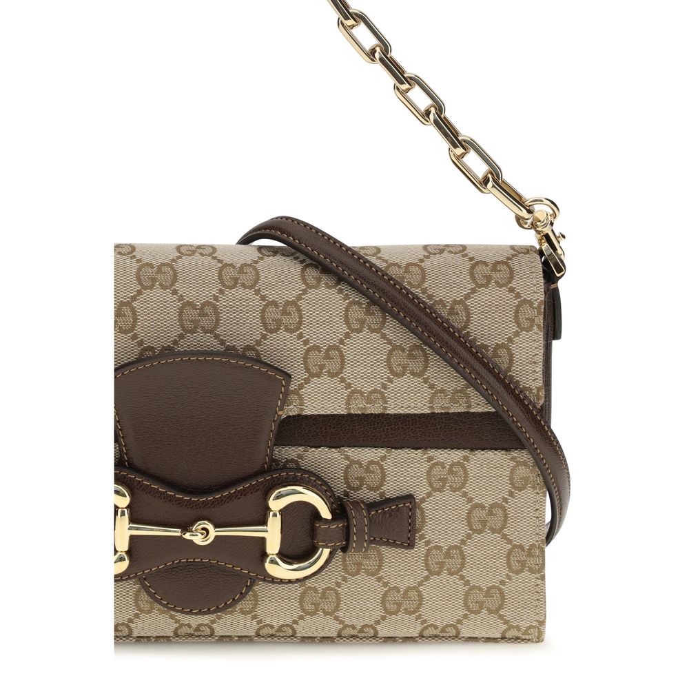 Gucci beige fabric shoulder bag with adjustable strap and gold-tone hardware, stylish accessory for everyday use.
