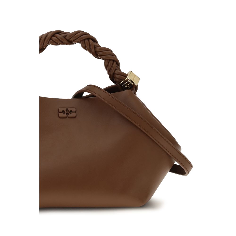 Ganni brown recycled leather handbag with sleek design and top handle, featuring subtle stitching and minimalist style.