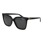 Polaroid black polycarbonate sunglasses with sleek frame and dark tinted lenses, designed for UV protection and stylish wear