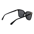 Polaroid black polycarbonate sunglasses with sleek frame and tinted lenses, styled for modern sun protection.