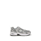 Gray New Balance athletic sneakers made from polyamide fabric, designed for comfort and performance.