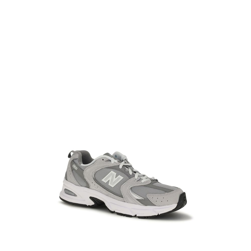 Gray New Balance athletic sneakers made of polyamide, featuring a sleek design and supportive athletic footwear for active wear.