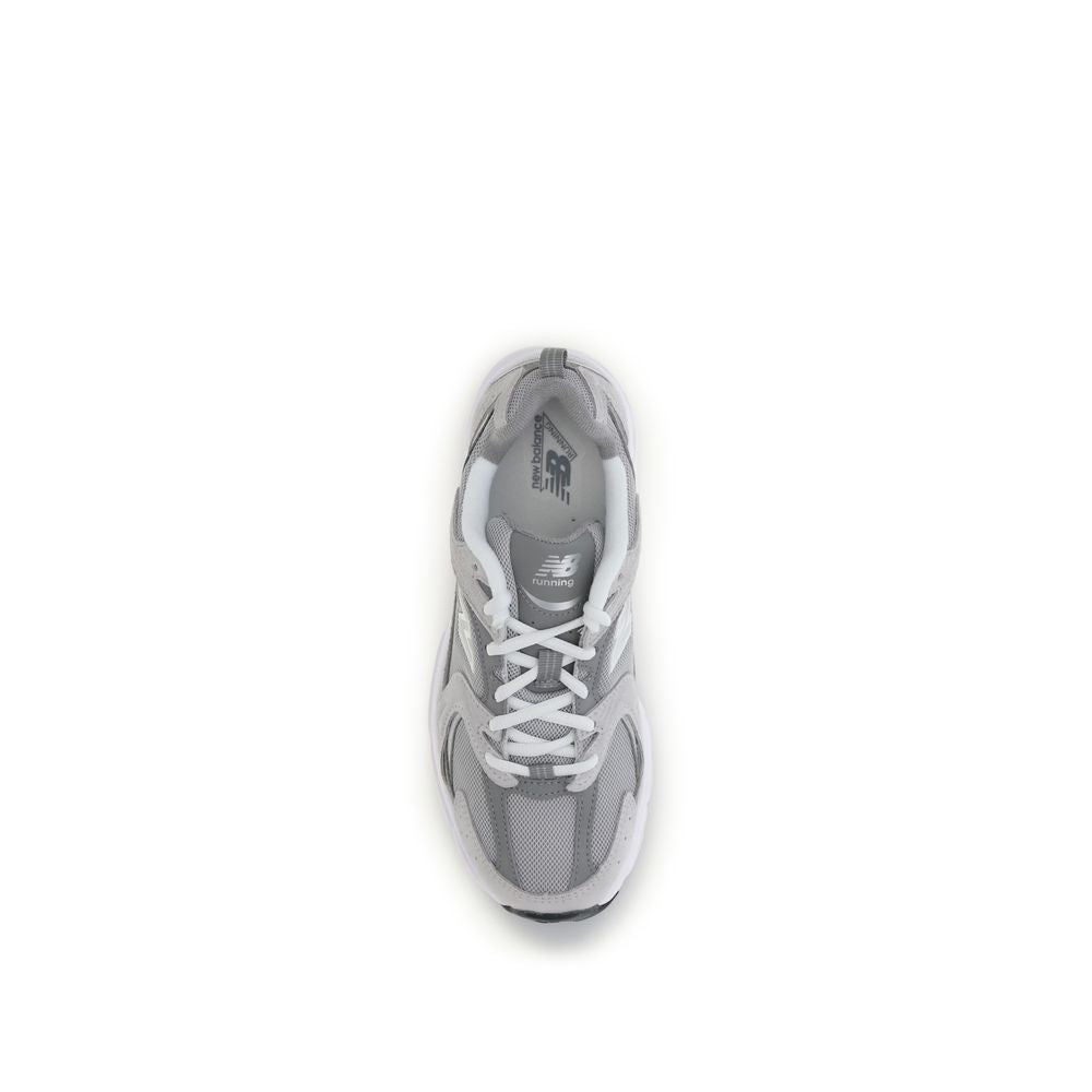 Gray New Balance athletic sneakers made of polyamide with breathable fabric, featuring a sleek design and sporty silhouette.