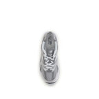 Gray New Balance athletic sneakers made of polyamide with breathable fabric, featuring a sleek design and sporty silhouette.