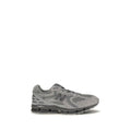 Gray fabric athletic sneakers by New Balance featuring breathable material and supportive design for active wear.