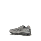 New Balance gray fabric athletic sneakers with white soles and breathable design, suitable for running and casual wear.