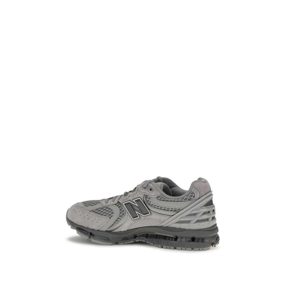 New Balance gray fabric athletic sneakers with white soles and breathable design, suitable for running and casual wear.