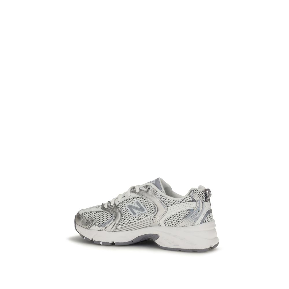 White New Balance athletic sneakers with polyamide uppers, featuring a sporty design and cushioned soles for active wear.