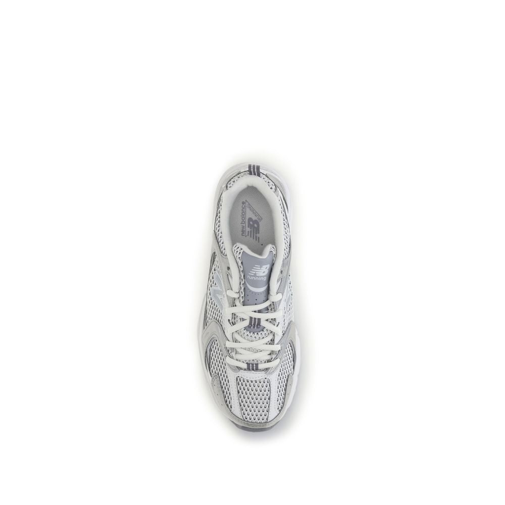 White New Balance athletic sneakers made of polyamide, featuring a sleek design and breathable material for active wear.