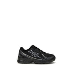Black New Balance athletic sneakers made of polyamide, featuring a sleek design suitable for sports and casual wear.