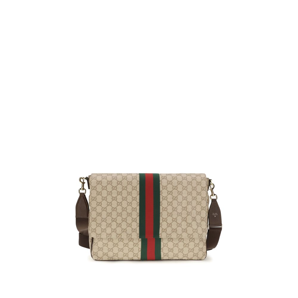 Gucci beige cotton shoulder bag with adjustable strap and subtle logo details, stylish accessory for everyday wear.