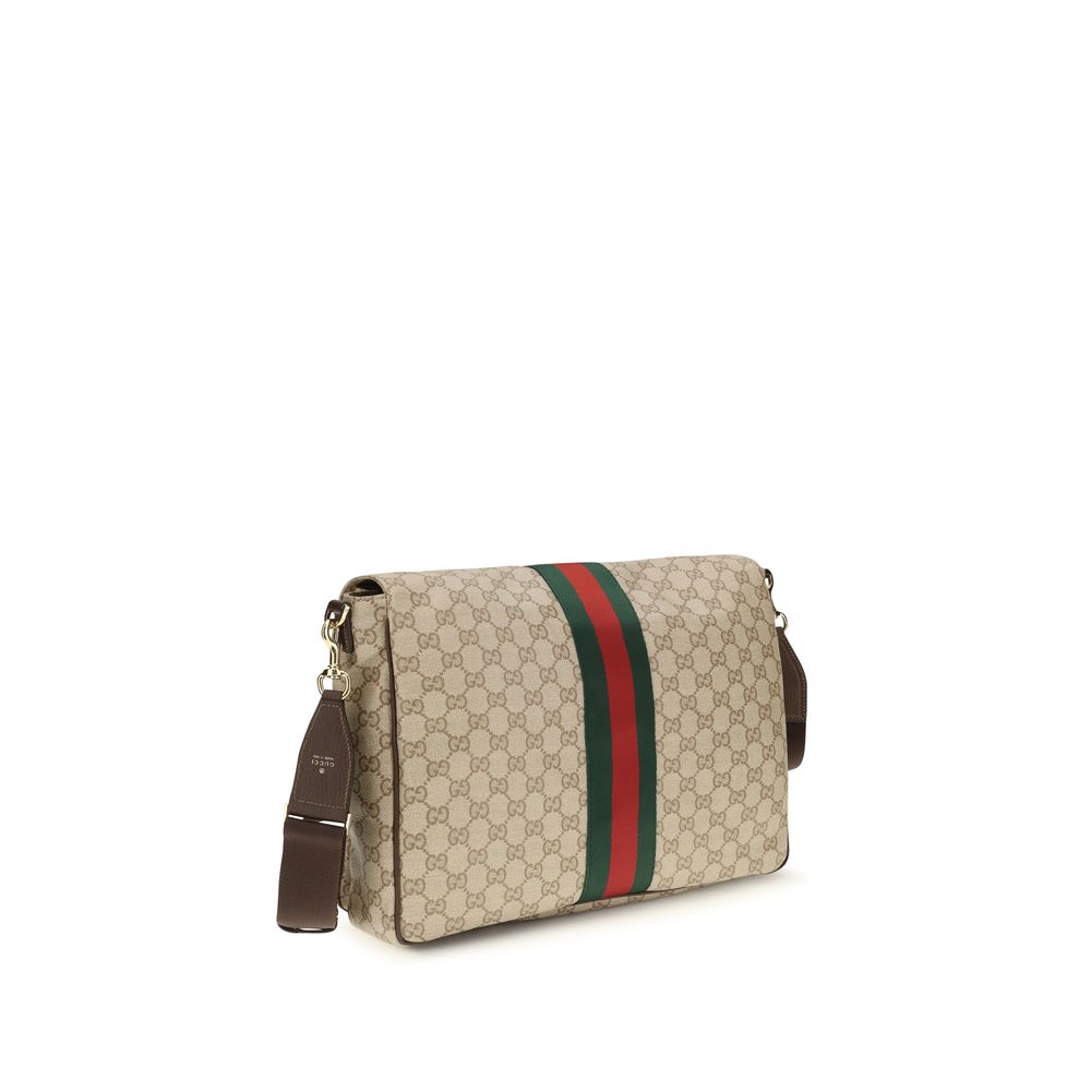 Gucci beige cotton shoulder bag with adjustable strap and subtle logo detail, stylish and versatile for everyday use.