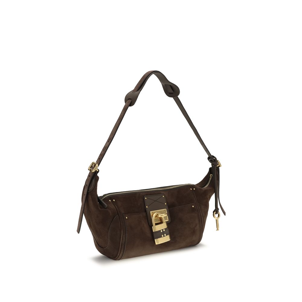 Chloé brown calf leather Bos Taurus shoulder bag with top handle and gold-tone hardware on a plain background.