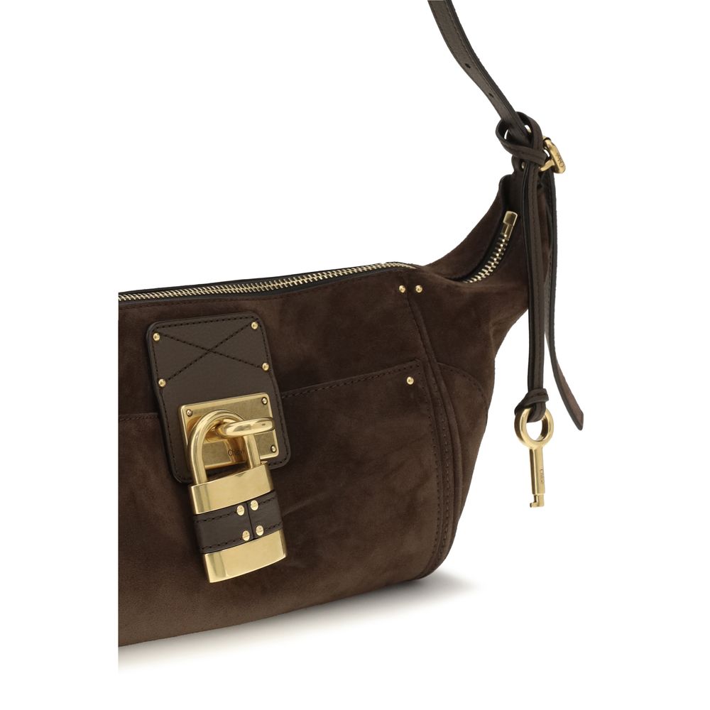 Chloé brown calf leather Bos Taurus shoulder bag with top handle and gold-tone hardware, stylish and elegant accessory.