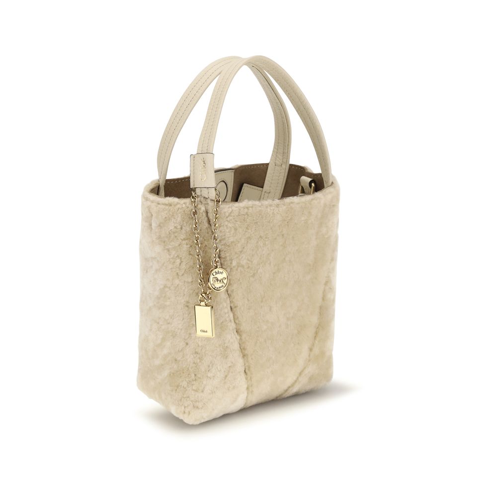 Chloé beige calf leather Bos Taurus bucket bag with drawstring closure and shoulder strap, stylish and spacious for everyday use.