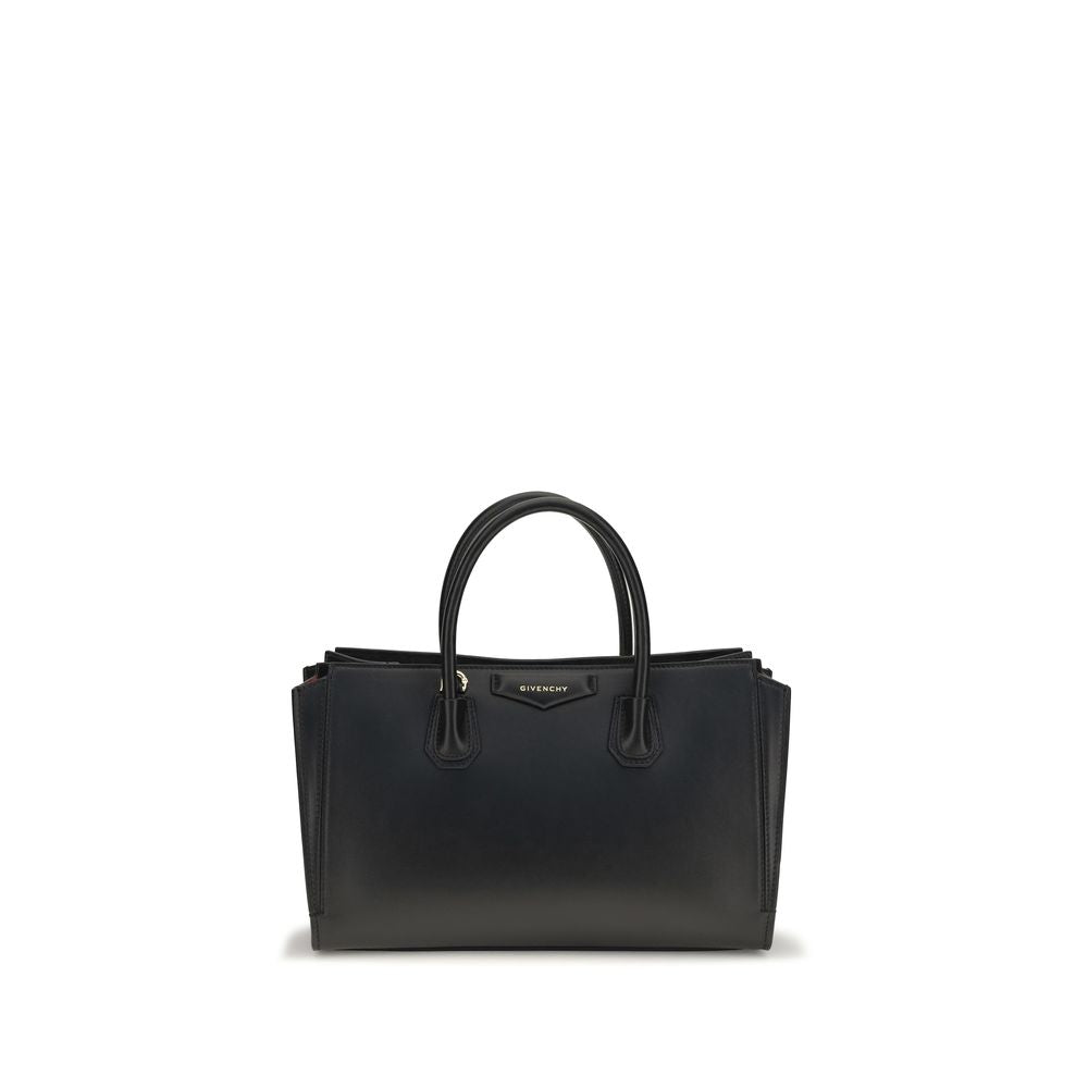 Givenchy Bos Taurus black calf leather handbag with structured design and silver hardware, showcasing elegant craftsmanship.