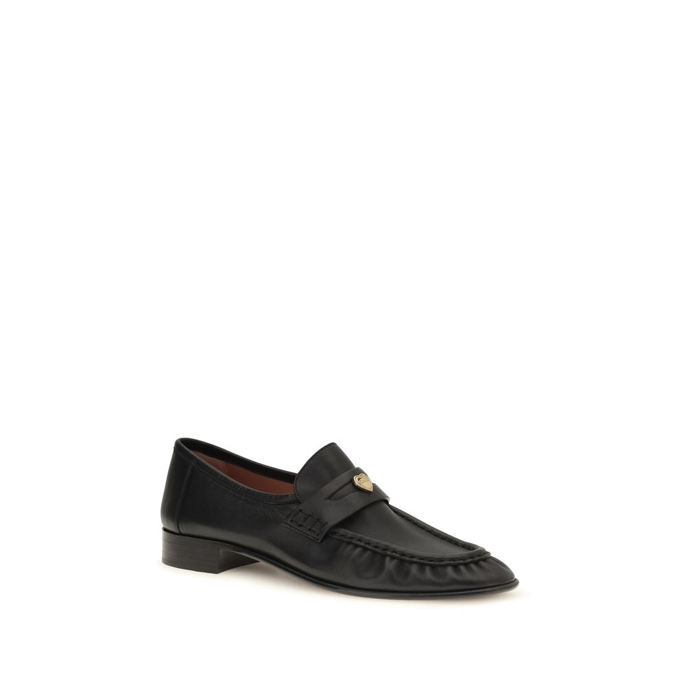 Chloé Black Calf Leather Bos Taurus Slip-On Loafers showing sleek design and smooth leather finish.